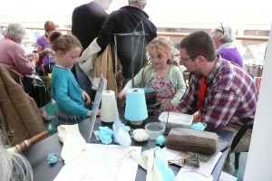 Maker Faire Brighton Tom with children and sock machine 20130907 0309 PMS